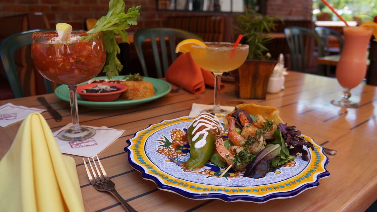 El Portal cocktails and Mexican food on a table